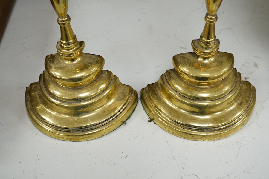 Two brass semi circular door porters, 45cm high. Condition - minor scraping to brass